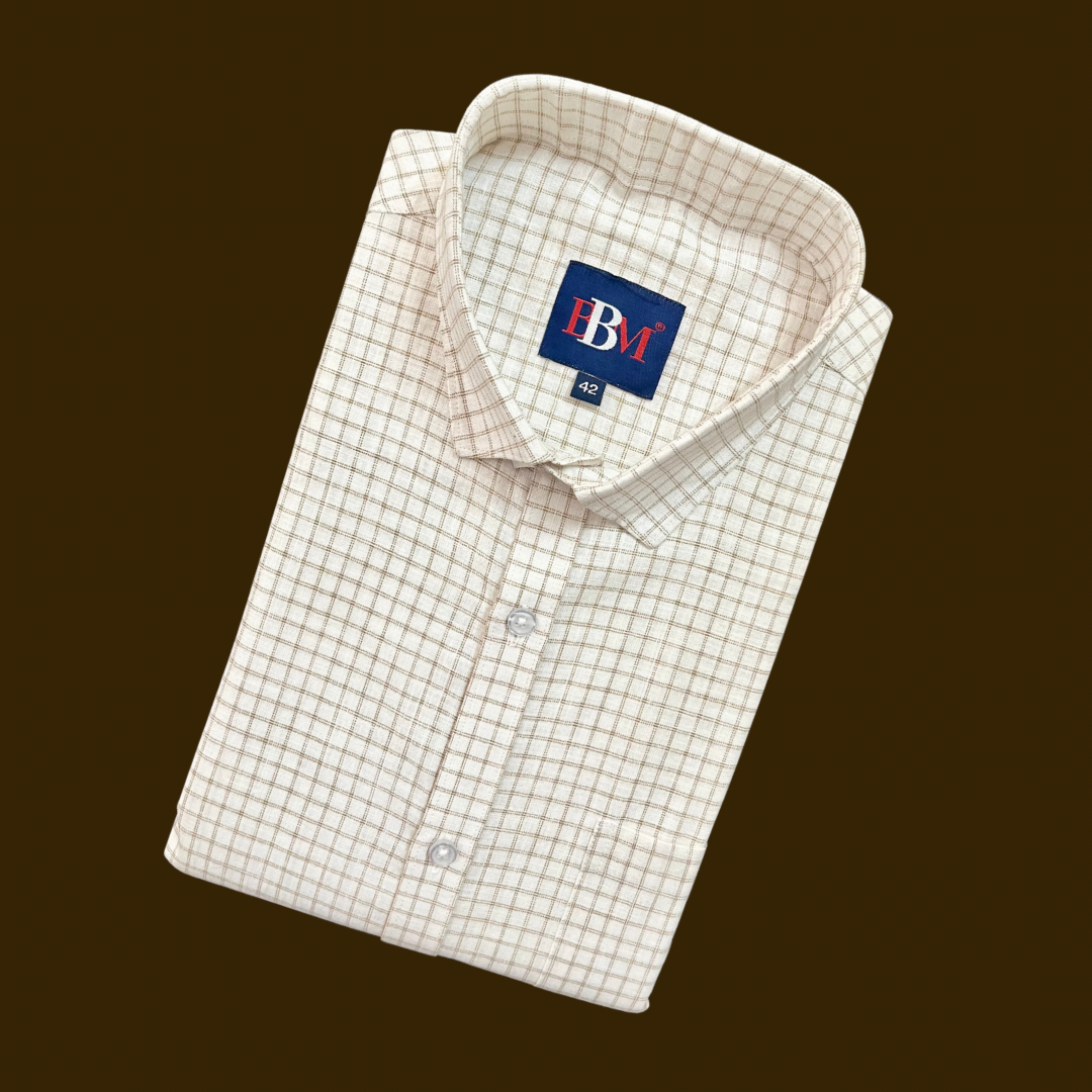 Folded checkered shirt with a brand label on a black background