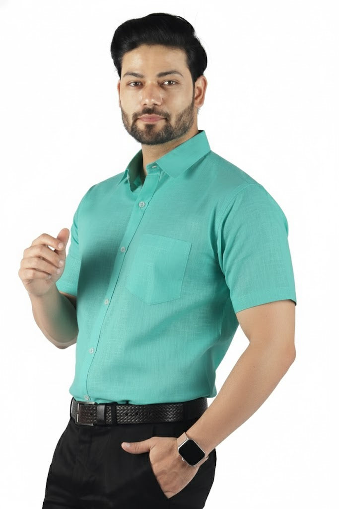 Half sleeve green linen shirt for men, clean and understated design with soft breathable fabric.