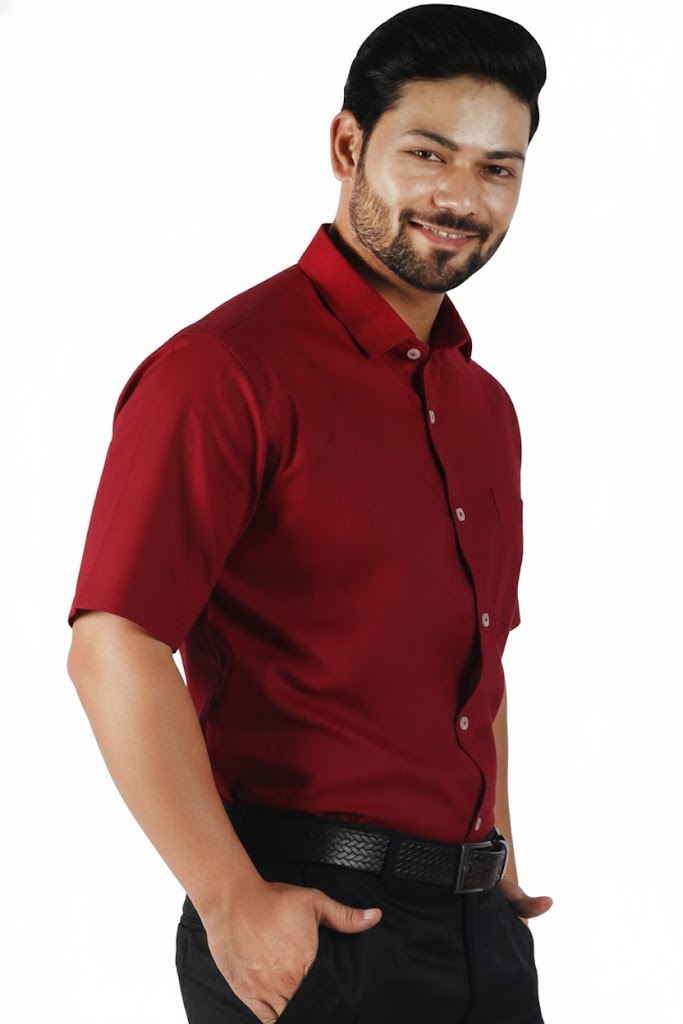 Man wearing a red shirt and black pants on a white background